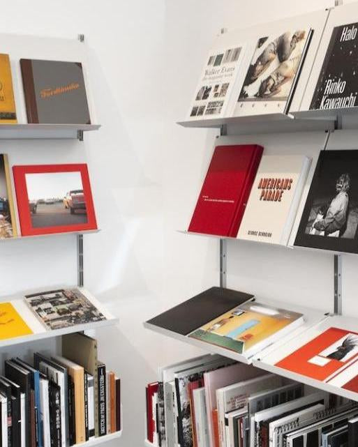 Coffee table books on the shelves of Blank Canvas Bookstore