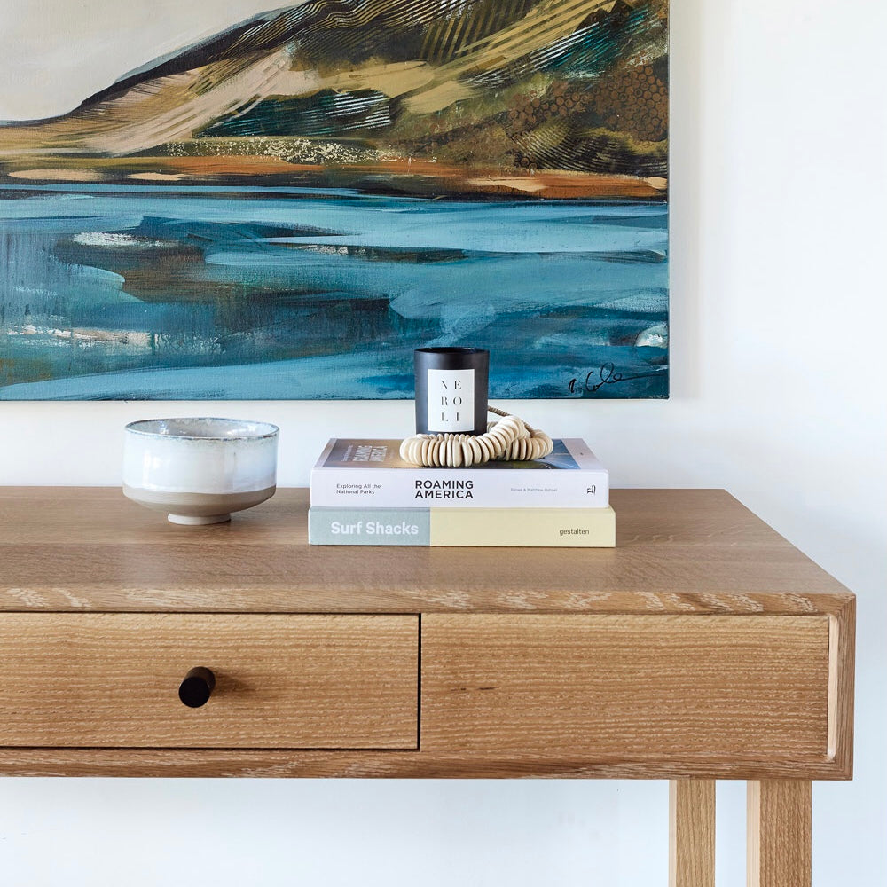 Wood table with stacked books